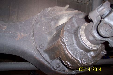 1978 Ford Bronco - Close-up view of a vehicle's rear axle differential housing and U-joint.