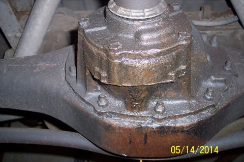 1978 Ford Bronco - Underside view of a vehicle's rear differential, showing wear and grease accumulation.