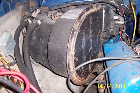 1978 Ford Bronco - Close-up view of the vehicle's heater core and plumbing, with visible wear and tear.