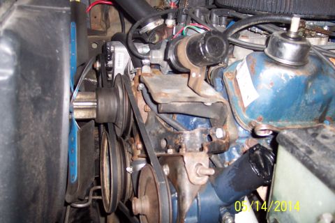 1978 Ford Bronco - Close-up view of engine components including pulleys, belts, and alternator.
