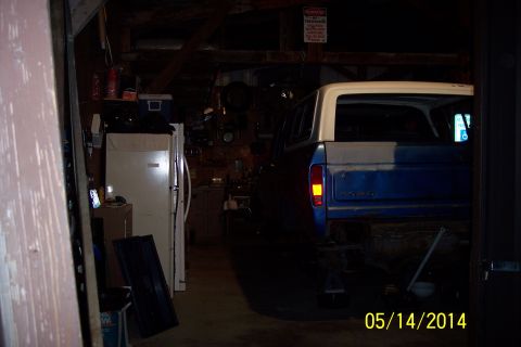 1978 Ford Bronco - This 1978 Ford Bronco is seen in a garage, partially painted blue and white.