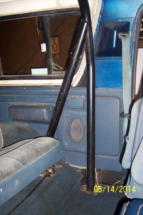 1978 Ford Bronco - The interior of a blue SUV is shown, a roll cage and blue upholstery. A date stamp is visible in the lower right corner.