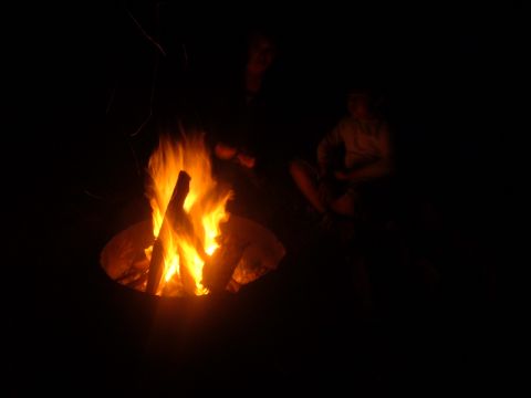 1988 Ford Bronco - People gather around a campfire at night.