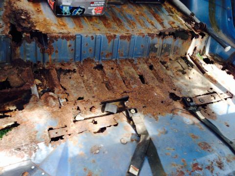 1979 Ford Bronco - The interior floor of this vehicle shows extensive rust damage and deterioration.
