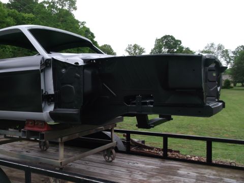1967 Ford Mustang - The body of a 1967 Ford Mustang is seen on a trailer, undergoing restoration.