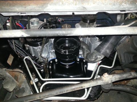 1994 Ford Bronco - Underside view of a vehicle's engine bay, showing various components and hoses.