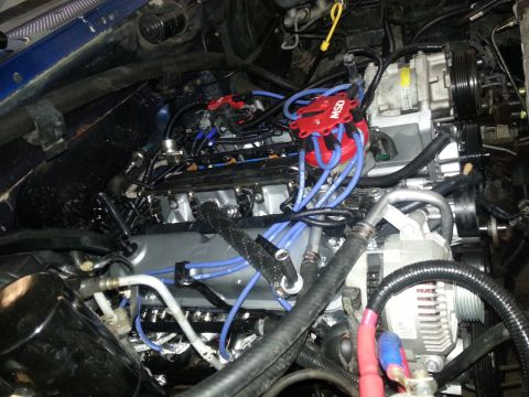 1994 Ford Bronco - Close-up view of an engine bay, showing various components and wiring.