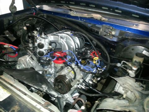 1994 Ford Bronco - Close-up view of a V8 engine in a vehicle's engine bay.