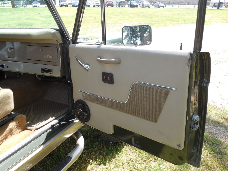Open Bronco passenger door with white vinyl panel, chrome trim and square mirror