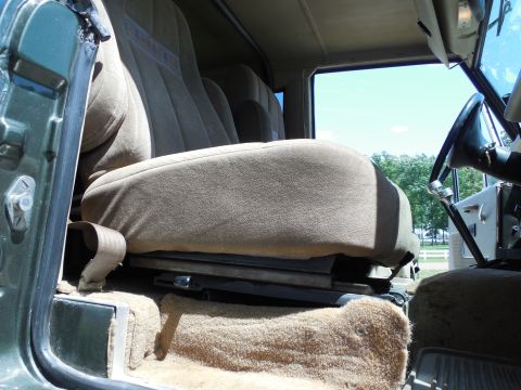 1975 Ford Bronco - Just like the driver's, this chair slides fore-aft (black lever in front), and reclines (chrome lever on the other side). But this one also…