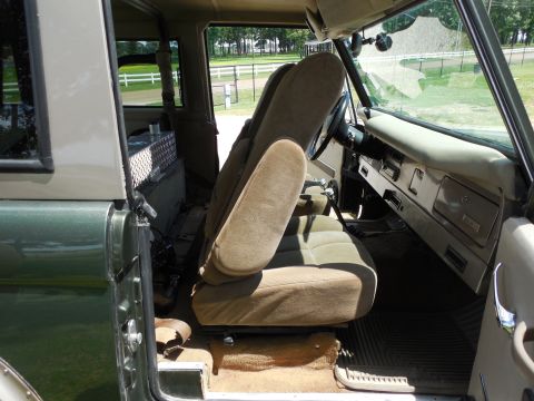 1975 Ford Bronco - Just like the driver's, this chair slides fore-aft (black lever in front), and reclines (chrome lever on the other side). But this one also…