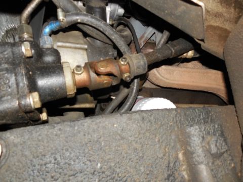 1975 Ford Bronco - Looking right from the LHF tire at the Saginaw pump, oil filter, and L ex.man.
