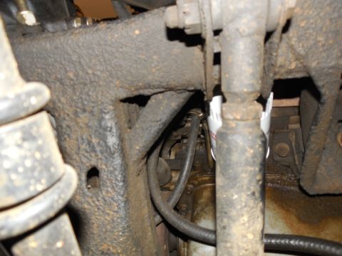 1975 Ford Bronco - Looking up from the LHF tire at the track bar, oil filter, & oil pan