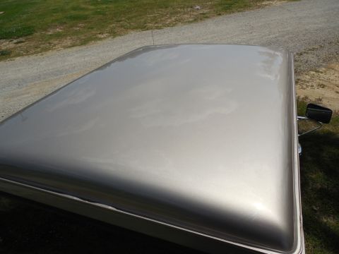 1975 Ford Bronco - Those are reflections of clouds & trees - the paint is immaculate.