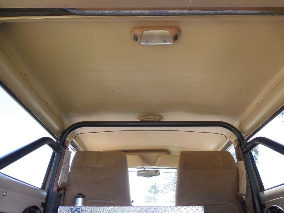 There are 3 dome lamps.  The stock one in the wiper motor cover, and these 2 later ones with map lamps.  Then there's another cargo lamp out-of-frame in the Left bedwall panel near the tailgate which switches between On and Auto (linked to the door courtesy lamp switches).