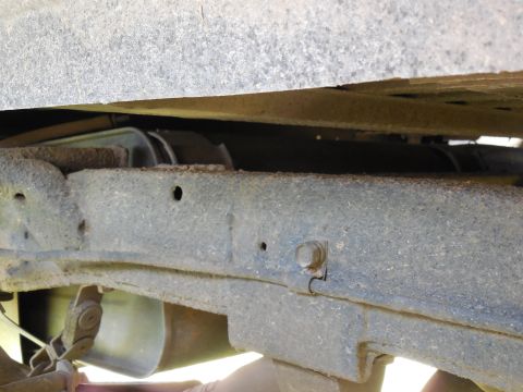 1975 Ford Bronco - RHR wheelwell looking rearward across the frame.