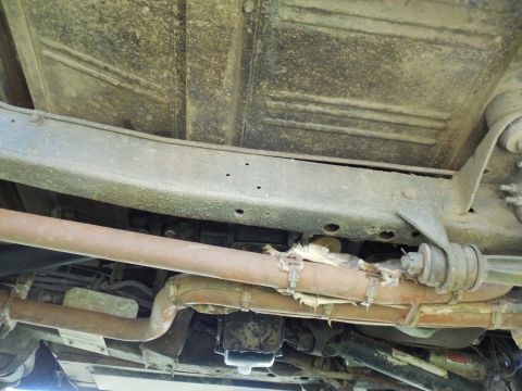 1975 Ford Bronco - RHS looking across under the frame. Note the extra holes on the bottom face of the frame behind the radius arm nut which I added to install…