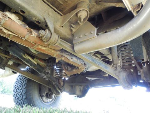 1975 Ford Bronco - RHS looking forward under the frame. Note the extra holes on the bottom face of the frame behind the radius arm nut which I added to instal…