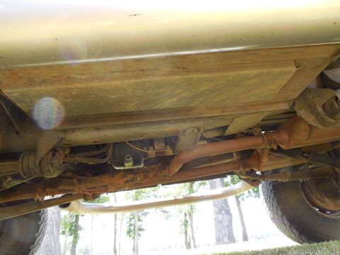 1975 Ford Bronco - LHS looking across under the frame. Note the extra holes on the bottom face of the frame behind the radius arm nut which I added to install…