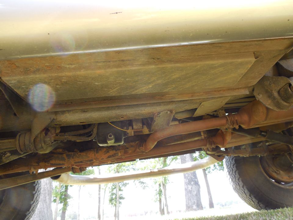 LHS looking across under the frame.

Note the extra holes on the bottom face of the frame behind the radius arm nut which I added to install the nuts for the relocated crossmember.  They also drain the frame effectively.