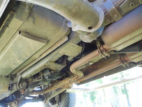 1975 Ford Bronco - LHR wheelwell looking forward under the frame. The drain holes I added to the nerf steps before powdercoating appear to have been effective…