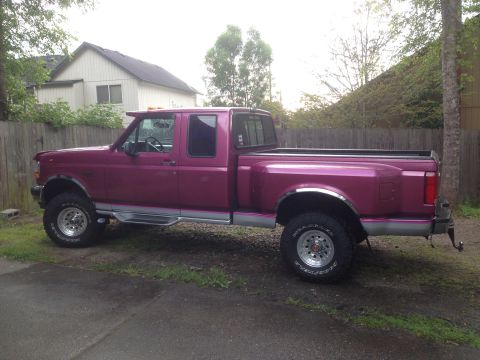 1992 Ford F-150 - This 1992 Ford F-150 pickup truck is shown from the side in a residential setting.