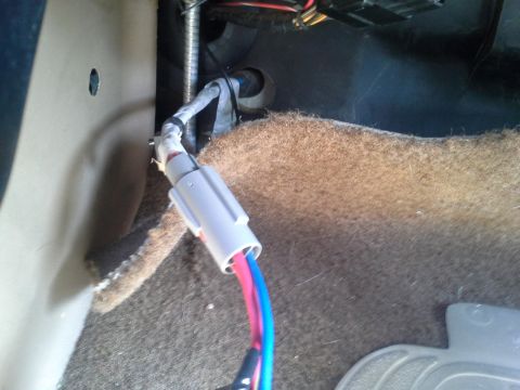 1991 Ford F-250 - Close-up of the interior wiring harness and carpet in a 1991 Ford F-250.