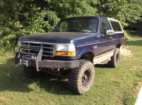 1995 Ford Bronco - This modified 1995 Ford Bronco features a custom bumper with a winch and large off-road tires.