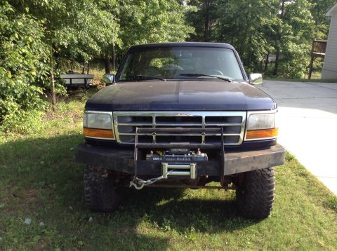 1995 Ford Bronco - Front view of a 1995 Ford Bronco equipped with a heavy-duty bumper and winch.