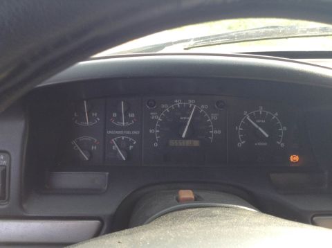 1995 Ford Bronco - Interior view of a vehicle's dashboard, showing various gauges and the odometer reading.