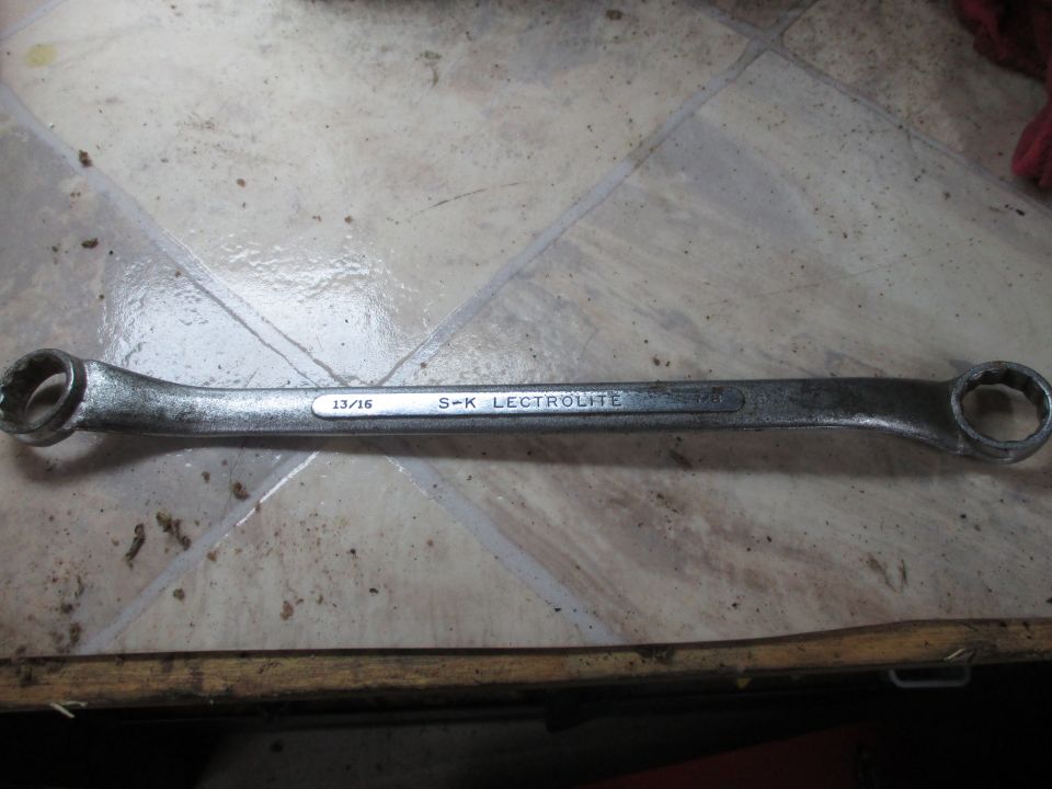 Wrench with 13/16 S-K LECTROLITE markings, lying on a tiled surface