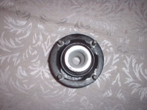1996 Ford Taurus - A single strut mount is shown against a patterned fabric, with a website watermark present.