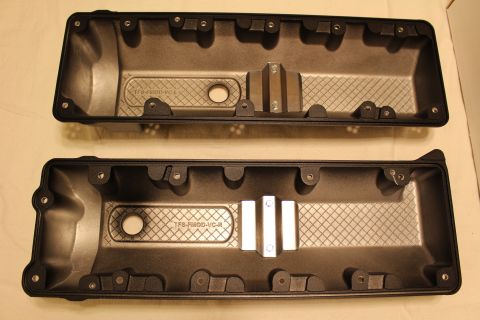 2003 Ford Crown Victoria - pair of black valve covers shown from beneath, cast with TFS-FMOD-VC-L and TFS-FMOD-VC-R identifiers in the baffle area.