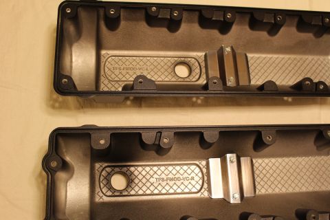 2003 Ford Crown Victoria - Detail of two valve cover undersides showing diamond baffles and cast part text reading TFS-FMOD-VC-L and TFS-FMOD-VC-R.