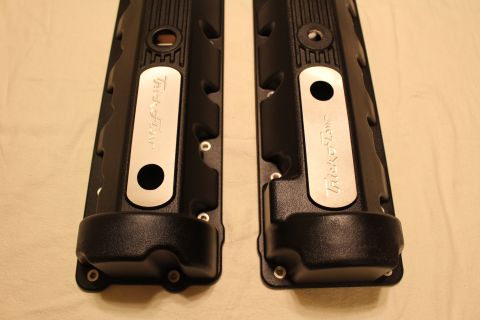 2003 Ford Crown Victoria - Top view of two black finned valve covers fitted with brushed aluminum plates engraved Trick Flow.