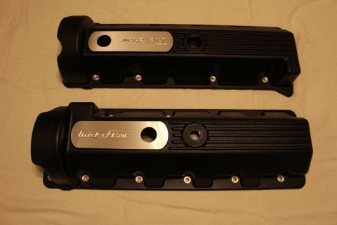 2003 Ford Crown Victoria - Two black finned valve covers displayed on cloth, each with a brushed aluminum Trick Flow nameplate near the oil-fill opening.