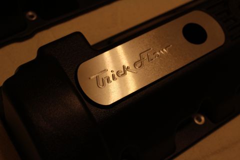 2003 Ford Crown Victoria - Close-up of a black crinkle-finish valve cover with a polished aluminum insert engraved with the Trick Flow logo.