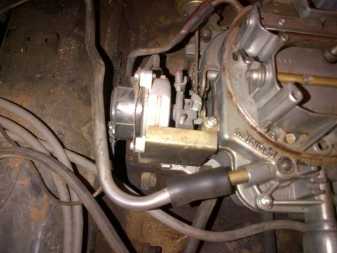 1978 Ford Bronco - A close-up view of a Motorcraft carburetor, a component of the vehicle's engine system.