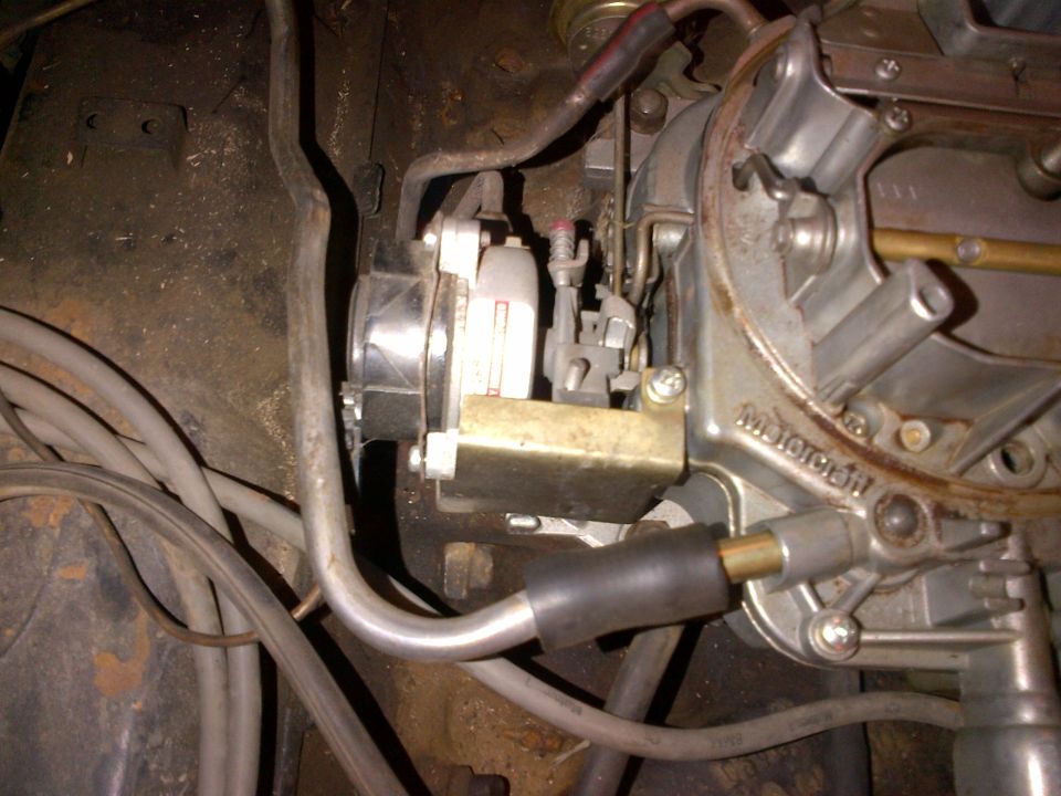 Close-up of a carburetor with visible "Motorcraft" text