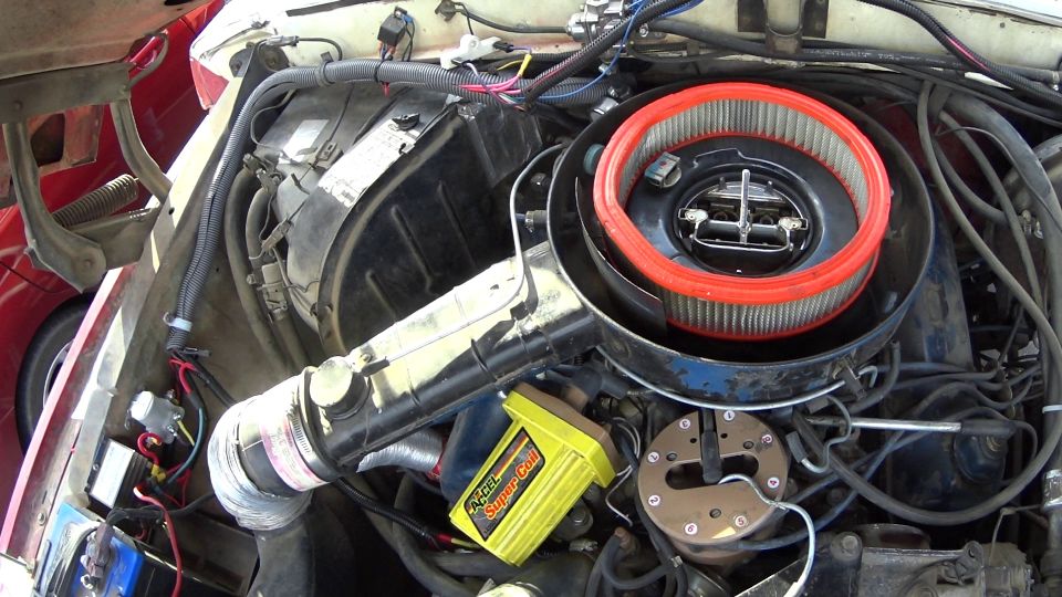 Engine bay with air filter and yellow Accel Super Coil