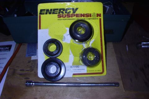 1995 Ford Bronco - A package of Energy Suspension polyurethane bushings is shown with a socket extension tool on a wooden surface.