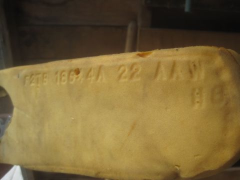 1993 Ford Bronco - Close-up of a yellow foam part showing stamped identification numbers.