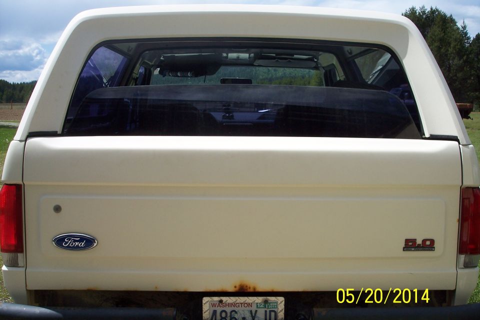 Rear of a white 1990 Ford Bronco with a 5.0 badge and Washington license plate