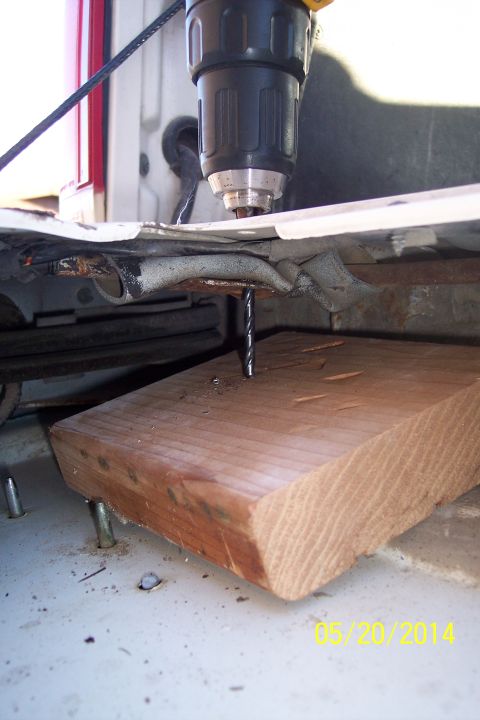 1990 Ford Bronco - Drilling into the vehicle body with a wood block for support. The date 05/20/2014 is visible.