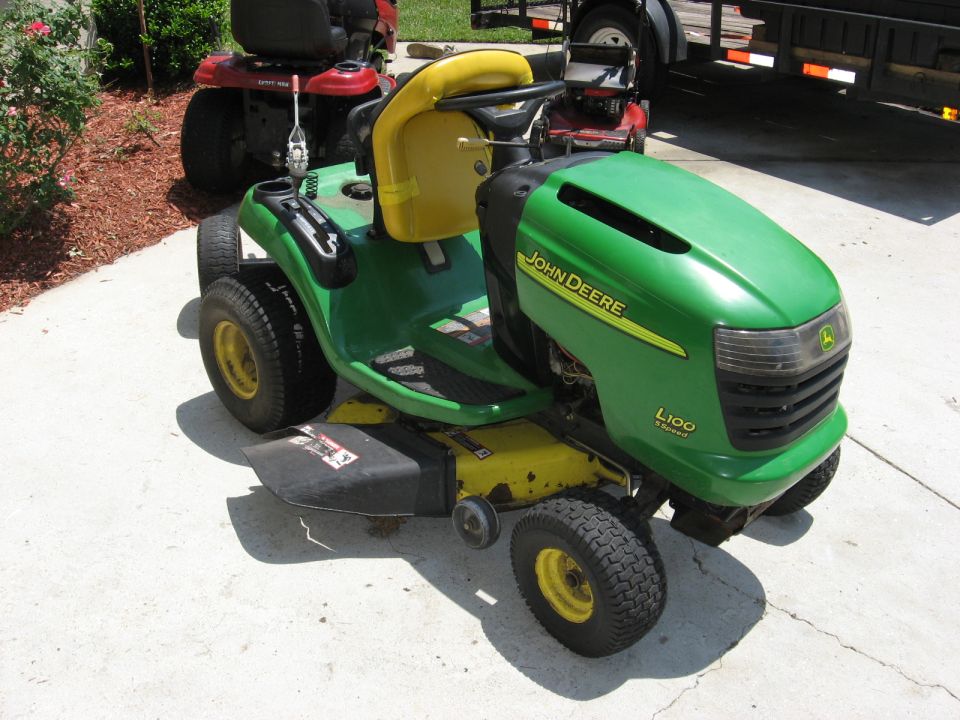 John Deere L100 lawn tractor with yellow seat and deck