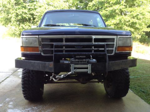 1995 Ford Bronco - Front view of a 1995 Ford Bronco equipped with a winch and heavy-duty bumper.