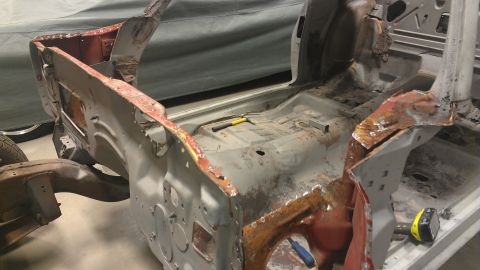 1970 Pontiac Trans Am - Car body frame undergoing restoration, showing significant rust and damage.