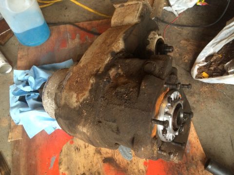 1991 Ford F-250 - Close-up of a greasy differential housing, likely removed for repair or replacement.