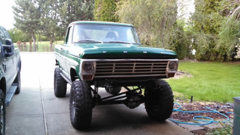 1967 Ford F-250 - Front view of a lifted 1967 Ford F-250 pickup truck, parked on a driveway.