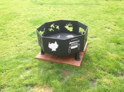 1978 Ford Bronco - Fire pit features cutouts of wildlife and a Jeep grille design.